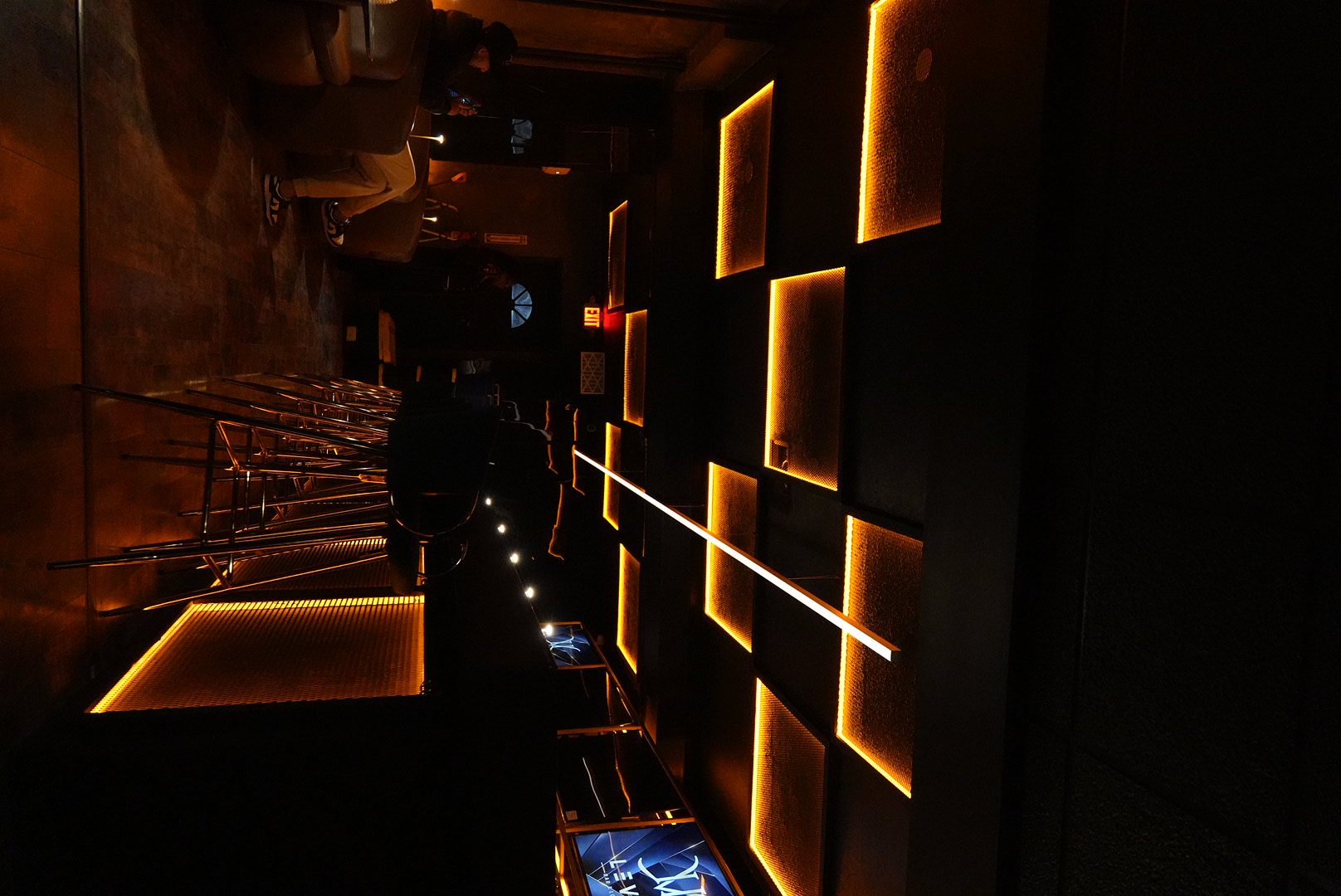 Glowing ceiling panels above the LVL bar